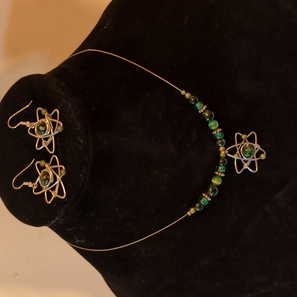 Green Beaded Metal Necklace And Earrings With Atom Symbol